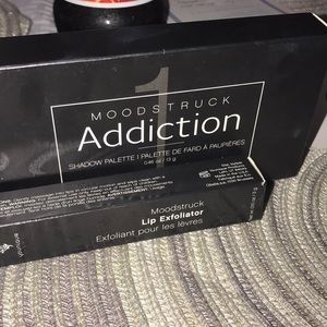 Younique eyeshadow palette and lip exfoliator.